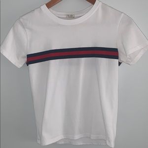 white T-shirt with red and blue strips through it